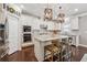 Well-appointed kitchen featuring granite countertops, stainless steel appliances, a kitchen island, and modern fixtures at 422 Silver Brook Dr, Woodstock, GA 30188