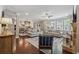 Bright, open-concept living space with hardwood floors, fireplace, and a seamless flow into the dining area at 422 Silver Brook Dr, Woodstock, GA 30188