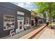 Retail storefront 'Dare to be Different ' with large display windows on a walkable street at 422 Silver Brook Dr, Woodstock, GA 30188