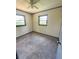 Bedroom includes carpet flooring, neutral walls and natural light at 50 Evelyn Rd, Covington, GA 30016