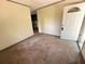 Inviting entryway features neutral walls, carpet flooring and a white door with an ornate glass design at 50 Evelyn Rd, Covington, GA 30016