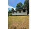 Exterior view of the home with a compact design and a functional layout in a quiet neighborhood at 50 Evelyn Rd, Covington, GA 30016