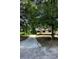 Single story home with a long driveway and mature trees at 50 Evelyn Rd, Covington, GA 30016