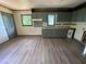 Kitchen features durable vinyl flooring, gray cabinets, granite counter tops and modern appliances at 50 Evelyn Rd, Covington, GA 30016
