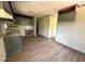 Kitchen area with new vinyl flooring, cabinets, and countertops at 50 Evelyn Rd, Covington, GA 30016