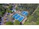 Aerial view of community amenities: pool, tennis courts, playground, and parking at 10280 Medridge Cir, Johns Creek, GA 30022