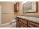 Bathroom features granite countertop, decorative mirror, vanity with storage, and shower-tub combo at 10280 Medridge Cir, Johns Creek, GA 30022