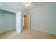 This bedroom offers neutral carpet, blue walls, a ceiling fan and a closet for plenty of storage space at 10280 Medridge Cir, Johns Creek, GA 30022