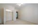 This bedroom features a neutral carpet, a ceiling fan and a closet, offering plenty of storage at 10280 Medridge Cir, Johns Creek, GA 30022