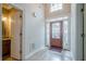 Beautiful foyer with high ceilings, chandelier, and decorative front door at 10280 Medridge Cir, Johns Creek, GA 30022