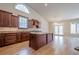 Gourmet kitchen with an island, custom cabinets, and stainless steel appliances at 10280 Medridge Cir, Johns Creek, GA 30022