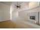 Living room featuring vaulted ceilings, fireplace, and plush carpet at 10280 Medridge Cir, Johns Creek, GA 30022