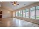 Spacious living room with hardwood floors and many large windows at 10280 Medridge Cir, Johns Creek, GA 30022