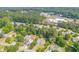 Overhead shot of community highlighting home with green lawns, mature trees and the nearby commercial areas at 3288 Owens Meadow Ln, Kennesaw, GA 30152