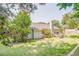 Large backyard with well-maintained lawn and a covered patio, providing ample space for outdoor activities at 3288 Owens Meadow Ln, Kennesaw, GA 30152