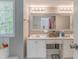 Bathroom with double sinks, bright lighting, and neutral paint at 3288 Owens Meadow Ln, Kennesaw, GA 30152