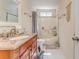 Cozy bathroom featuring a vanity with granite countertop and a shower-tub combination at 3288 Owens Meadow Ln, Kennesaw, GA 30152