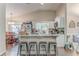 Open kitchen design with an island, white cabinets, and stainless steel appliances at 3288 Owens Meadow Ln, Kennesaw, GA 30152