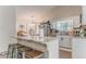 Kitchen island with seating and white cabinets at 3288 Owens Meadow Ln, Kennesaw, GA 30152