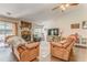 Comfortable living room with stone fireplace, hardwood floors, and natural light from sliding glass patio doors at 3288 Owens Meadow Ln, Kennesaw, GA 30152