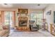 Inviting living room with a stone fireplace and sliding door access at 3288 Owens Meadow Ln, Kennesaw, GA 30152