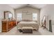 Bright main bedroom with vaulted ceiling, dresser, and comfortable seating, ideal for relaxation at 3288 Owens Meadow Ln, Kennesaw, GA 30152