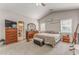 Large main bedroom with vaulted ceiling, comfortable bedding, and adjacent bathroom access at 3288 Owens Meadow Ln, Kennesaw, GA 30152