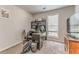 Functional home office with desk, shelving, and natural light, ideal for remote work at 3288 Owens Meadow Ln, Kennesaw, GA 30152