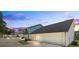 Backyard view of townhomes with private garages and well-maintained grounds at 5880 Garden Circle Cir, Douglasville, GA 30135