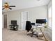Neutral bedroom with a desk, television, and chair near the window, perfect for a home office at 5880 Garden Circle Cir, Douglasville, GA 30135