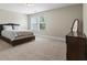 Clean bedroom features neutral carpet, natural light, and modern design at 5880 Garden Circle Cir, Douglasville, GA 30135