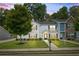 Charming two-story home boasts manicured lawn, tidy shrubbery, and a welcoming facade at 5880 Garden Circle Cir, Douglasville, GA 30135