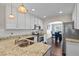 Modern kitchen features granite counters, stainless appliances, hardwood floors, and opens into dining area at 5880 Garden Circle Cir, Douglasville, GA 30135