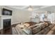 Open-concept living room with fireplace and a view of the modern kitchen at 5880 Garden Circle Cir, Douglasville, GA 30135