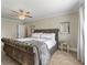 Comfortable main bedroom with decorative pillows, ceiling fan, and neutral paint at 5880 Garden Circle Cir, Douglasville, GA 30135