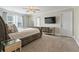 Spacious main bedroom features plush carpet, mirrored dresser, and modern lighting at 5880 Garden Circle Cir, Douglasville, GA 30135