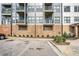 Modern building exterior with multiple balconies, brick facade, and parking at 898 Oak Sw St # 3420, Atlanta, GA 30310