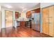 Modern kitchen with stainless steel appliances, wood cabinets, and a view into the living area at 898 Oak Sw St # 3420, Atlanta, GA 30310