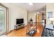 Spacious living room with hardwood floors, home office, and views into the kitchen at 898 Oak Sw St # 3420, Atlanta, GA 30310