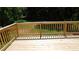 Wooden deck overlooking lawn and surrounded by trees at 9148 Homewood Dr, Riverdale, GA 30274