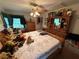 Traditional bedroom with natural lighting, hardwood furniture, and floral bedding at 1268 Woodland Ne Rd, Conyers, GA 30012