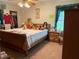 Traditional bedroom with natural lighting, hardwood furniture, and floral bedding at 1268 Woodland Ne Rd, Conyers, GA 30012