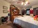 Traditional bedroom with natural lighting, hardwood furniture, and floral bedding at 1268 Woodland Ne Rd, Conyers, GA 30012
