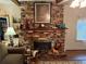View of brick fireplace with mantle at 1268 Woodland Ne Rd, Conyers, GA 30012