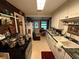 Functional kitchen features updated countertops, white cabinets, and stainless steel appliances at 1268 Woodland Ne Rd, Conyers, GA 30012