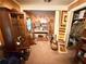 Cozy living room features wooden decor, neutral carpet, and vintage cabinets at 1268 Woodland Ne Rd, Conyers, GA 30012