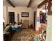 Open-concept living room features an area rug, wooden beams, and a comfortable seating area at 1268 Woodland Ne Rd, Conyers, GA 30012