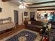 Hardwood floors and exposed beams can be seen in this living room view at 1268 Woodland Ne Rd, Conyers, GA 30012