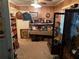 Cozy living room features wooden paneling, neutral carpet, and vintage cabinets at 1268 Woodland Ne Rd, Conyers, GA 30012