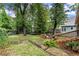 Expansive backyard featuring mature trees, a spacious deck, and ample space for outdoor enjoyment at 233 Spence Se Ave, Atlanta, GA 30317